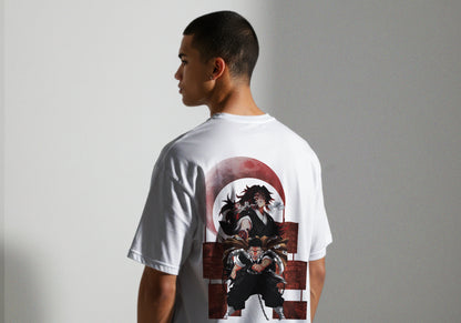 Person wearing a white t-shirt with a graphic design on the back against a plain background